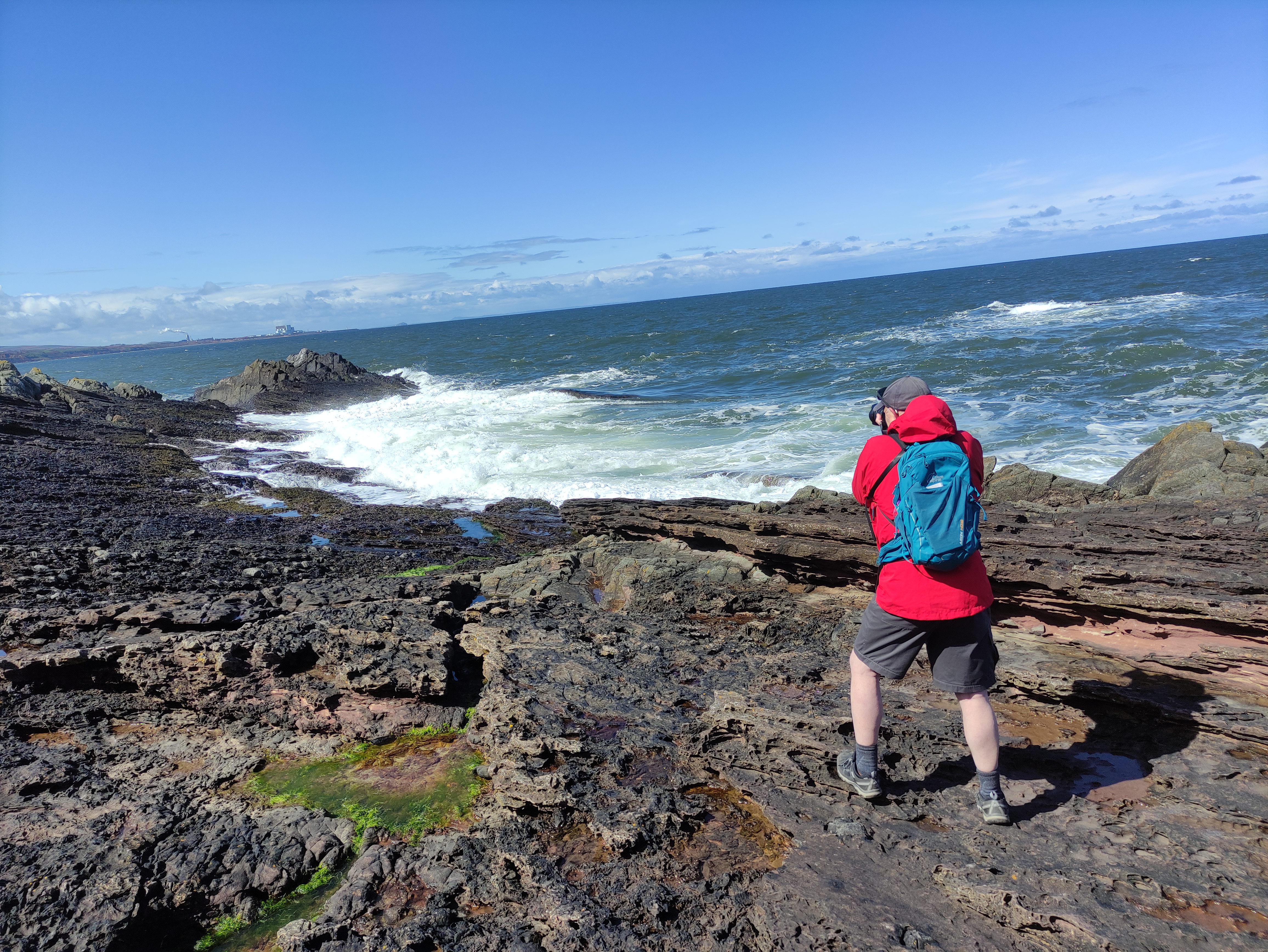 Stuart capturing the crashing waves